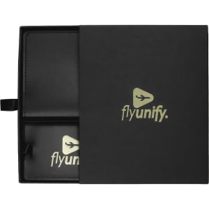 A black travel gift set featuring a sleek case with compartments, including luggage tags. It has a logo.
