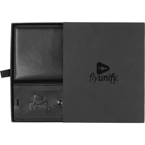 A black travel gift set featuring a wallet and luggage tag, presented in a sleek black box with a logo.