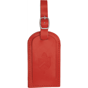 A red luggage tag featuring a decorative design and a buckle for attachment. It has a branded logo.