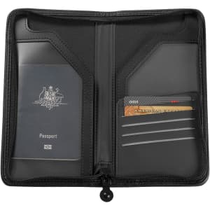 A black travel wallet with compartments for a passport and cards, featuring a logo on the inner side.