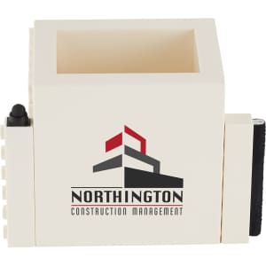 A cream-coloured pen pot with a square design and a logo, featuring a compartment for pens.
