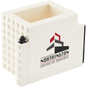 A cream-coloured pen pot with a textured surface and a branding logo on the front.