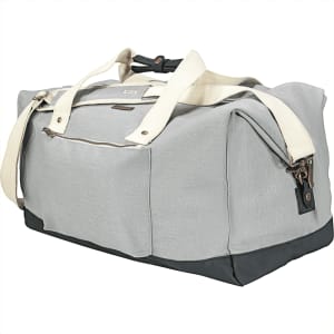 A grey cotton duffel bag with a darker base and cream straps, featuring a logo on the side.