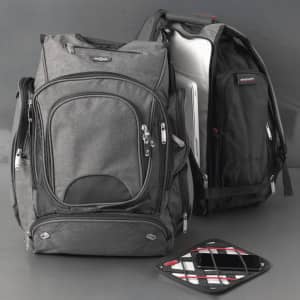 A black and grey checkpoint-friendly backpack with compartments, featuring a sleek design and a logo.