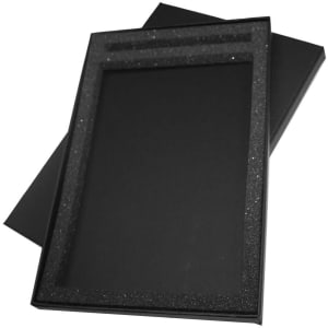 A black gift box with a glittery interior, designed to hold items like journals or pens. It has a sleek, elegant appearance.