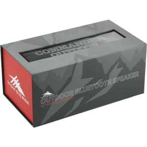 A grey and red box containing a High Sierra outdoor Bluetooth speaker with wireless charging features.