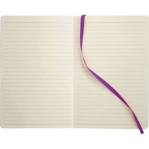 A soft bound journal with a cream interior, lined pages, and a purple ribbon bookmark. It has a branding logo on the cover.
