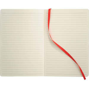 A soft bound journal with blank lined pages and a red ribbon bookmark in a neutral cover.