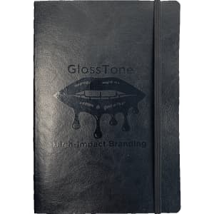 A black soft bound journal with an elastic closure and a logo printed on the cover.