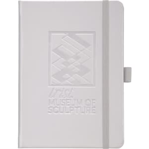 A white hard bound journal with an embossed design and elastic closure, featuring a logo on the front.