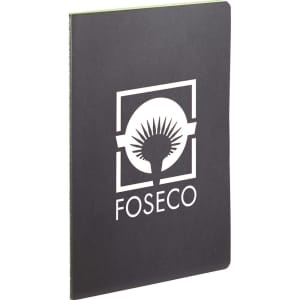 A black journal with a green interior and a logo on the front cover.