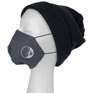 A grey Viroblock face mask worn on a mannequin head, paired with a black beanie. The mask features a logo.