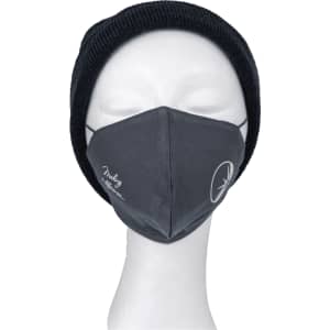 A grey face mask displayed on a mannequin head, featuring a logo and worn with a black beanie.