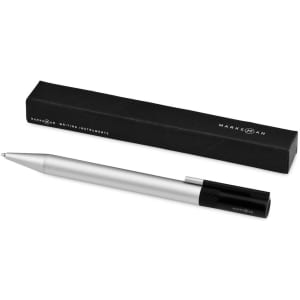 A silver ballpoint pen with a black cap, placed next to its black packaging. It features a logo on the pen.