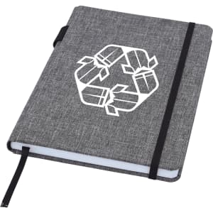 A grey A5 notebook with a black elastic band, featuring a logo on the cover.