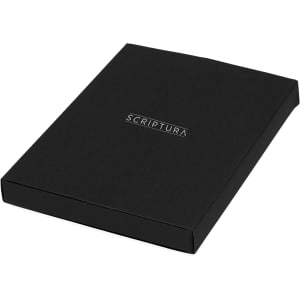 A black gift box containing a notebook and pen set, featuring a brand logo on the cover.