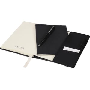 A black notebook and a black pen inside a black leather-like gift set, with a smaller white notebook included.