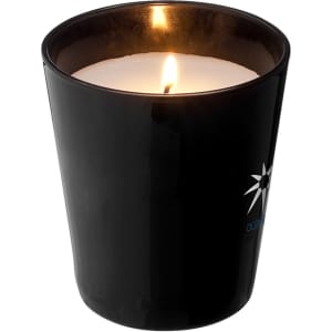 A black scented candle in a sleek container, featuring a glowing flame and a subtle logo.