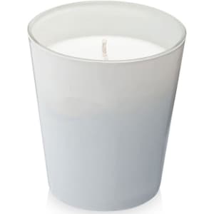 A grey glass candle holder with a white wax candle inside, featuring a single wick at the centre.