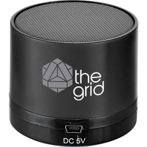 A black cylindrical Bluetooth speaker with a textured top and a logo on the side.