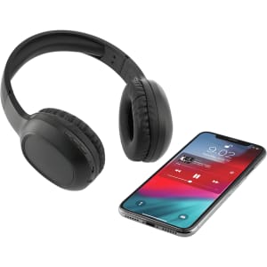 A pair of black Bluetooth headphones with a microphone next to a smartphone displaying a music player screen.