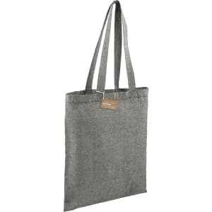 A grey recycled cotton twill tote bag with two shoulder straps and a tag attached. It features a logo.