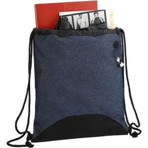 A drawstring sportspack in navy with black accents, containing a notebook and magazine. It has a logo.