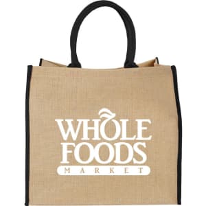 A large jute tote bag in natural colour with black handles and a logo on the front.