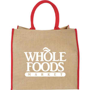 A large jute tote bag in natural colour with red handles, featuring a logo on the front.