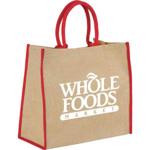 A large jute tote bag in natural brown with red handles and a logo. Ideal for carrying various items.