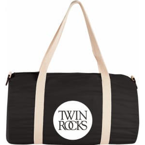 A black barrel duffel bag with cream straps and a logo on the front.