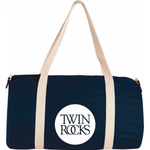 A dark blue barrel duffel bag with cream straps and a round logo in the centre.