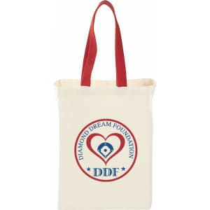 A natural cotton grocery tote bag in cream with red handles and a logo featuring a heart and text.