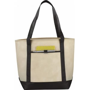 A large beige tote bag with black straps and a front pocket, featuring a pen and a notepad inside.