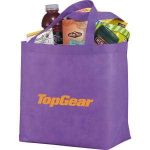 A purple non-woven tote bag filled with various products, featuring a logo on the front.