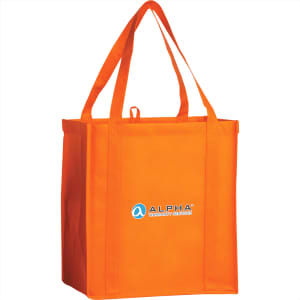 An orange non-woven grocery tote bag with two handles and a logo on the front.