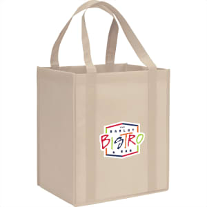 A beige reusable grocery tote with sturdy handles and a logo on one side. The bag has a square shape and is made of non-woven material.