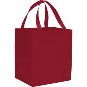 A red non-woven grocery tote bag with long handles and a square shape, featuring a logo.