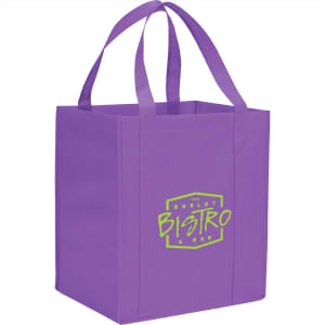 A purple non-woven grocery tote with a logo on the front. It features sturdy handles for carrying.