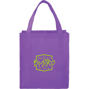 A purple reusable grocery tote with sturdy handles and a logo on the front.