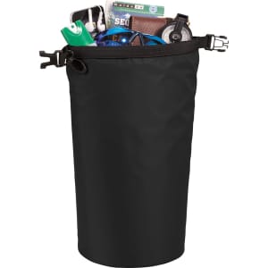 A black waterproof outdoor bag filled with various items like a drink bottle, phone charger, and small accessories.