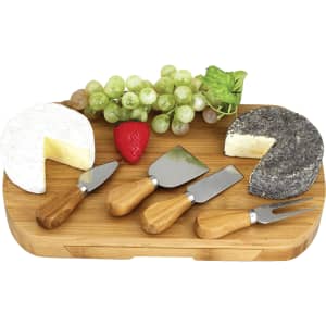 A wooden cheeseboard featuring two types of cheese, grapes, strawberries, and four stainless steel cheese knives with wooden handles.