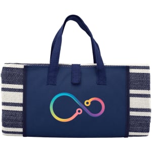 A navy blue picnic rug with a striped design and a colourful logo. It features sturdy handles for carrying.