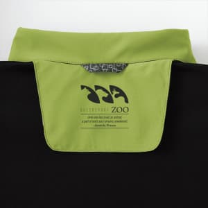 A black softshell jacket with a green collar, featuring a logo on the back.