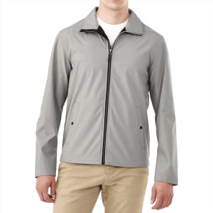 A men's softshell jacket in grey with a zipper front and side pockets, featuring a collar and a logo.