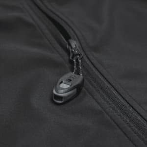A black softshell jacket featuring a zip closure and a branded pull tab.