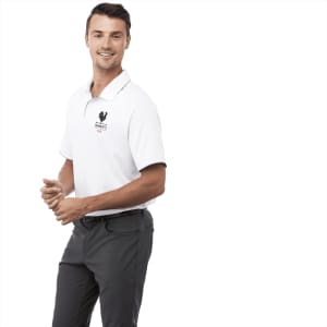 A white short sleeve polo shirt for men, featuring a logo, paired with grey trousers.