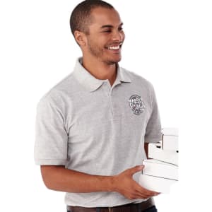 A grey short sleeve polo shirt for men, featuring a logo, worn by a smiling man carrying boxes.