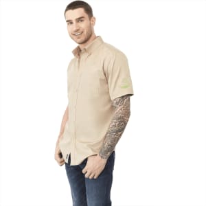 A men's short sleeve button-up shirt in beige with a pocket and a logo on the sleeve.