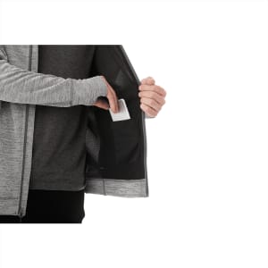 A grey men's knit zip hoodie featuring an inner pocket, held open by a hand. The fabric appears soft and comfortable.